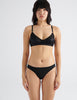front view of woman in black cotton bra and panty