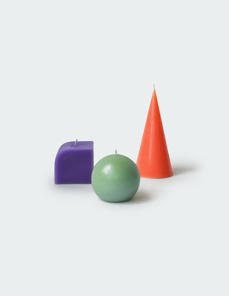 Three candles with different kinds of shapes and color