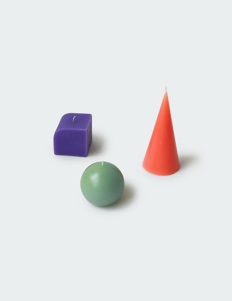 Three candles with different kinds of shapes and color