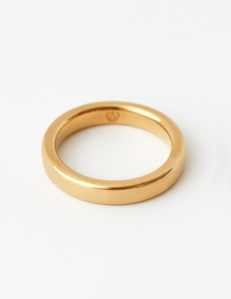 Solid 18k yellow gold simple wedding band with white background. 3.5mm tall. Essential Band by George Rings.