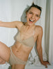 woman wearing nude cotton bra and matching panty by Araks
