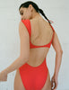 back view of woman wearing red bathing suit
