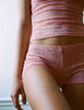woman in pink lace short