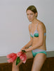 WOMAN WITH FLOWERS IN BLUE SILK BRA AND PANTY