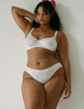 On model image of white cotton underwire bra and matching panty