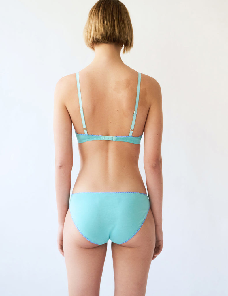 back view of woman in blue cotton bra