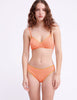 front view of woman wearing orange bra and panty