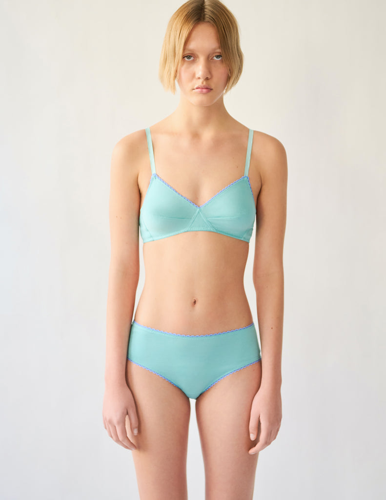 front view of woman in blue cotton bra and hipster