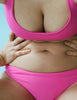 closeup of woman wearing pink bikini by Araks