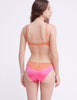 back of woman wearing pink and orange silk wireless bralette and matching panty by Araks