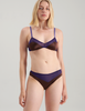 A woman wearing a blue and brown silk bra and panty by Araks