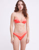 Woman wearing pink and peach silk wireless bralette and matching panty  by Araks