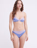 Woman wearing purple and blue silk bralette with matching panty by Araks