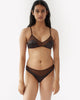 woman wearing two toned brown silk wireless bralette and matching panty by Araks