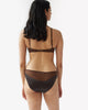 back of woman wearing two toned brown silk wireless bralette and matching panty by Araks