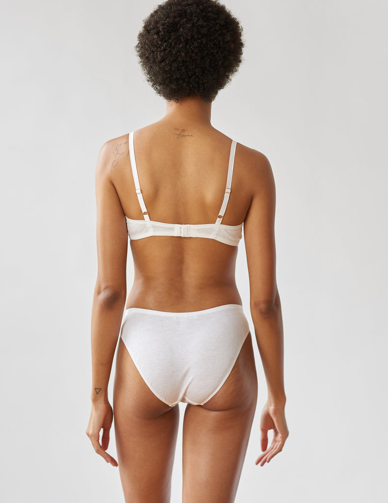 back of woman wearing white cotton underwire bra and matching panty by Araks