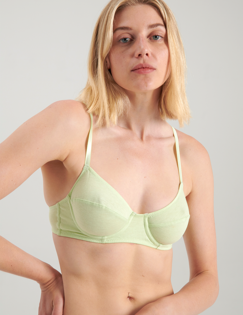 A woman wearing light green cotton underwire bra by Araks