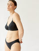 On model 3/4 image of black cotton underwire bra and panty