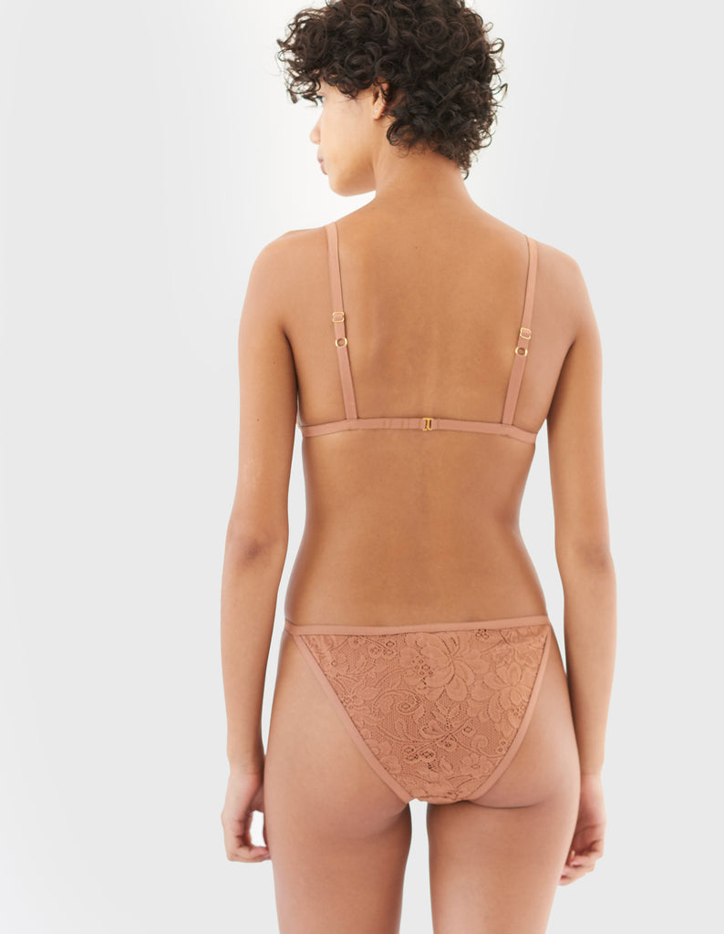 back of woman wearing brown string lace panty and matching triangle bra