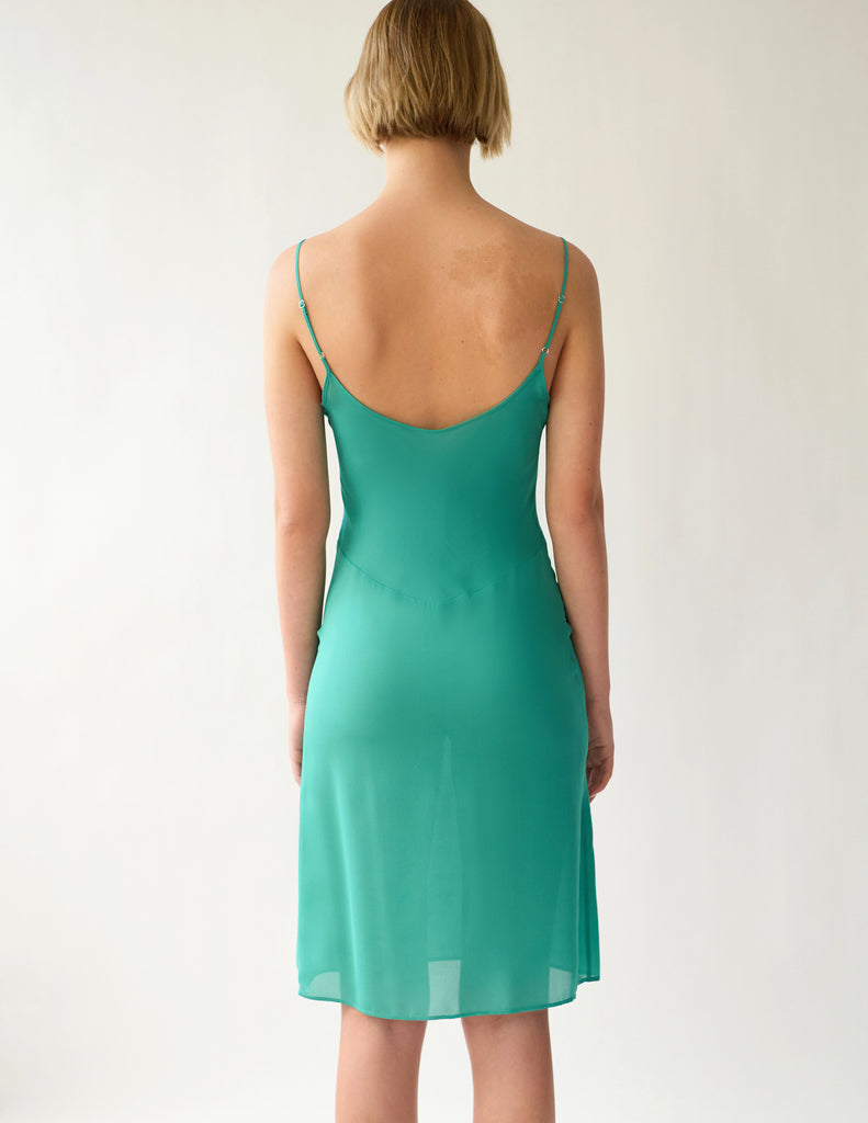 back view of green slip dress