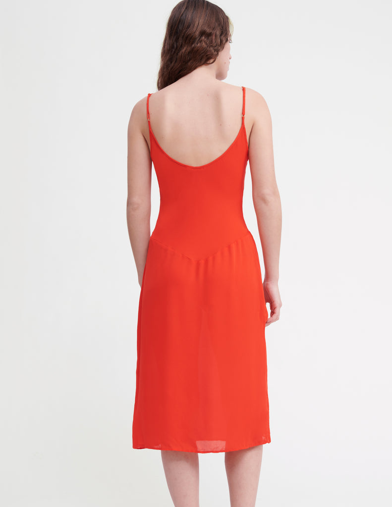 Back view of on model red slip dress