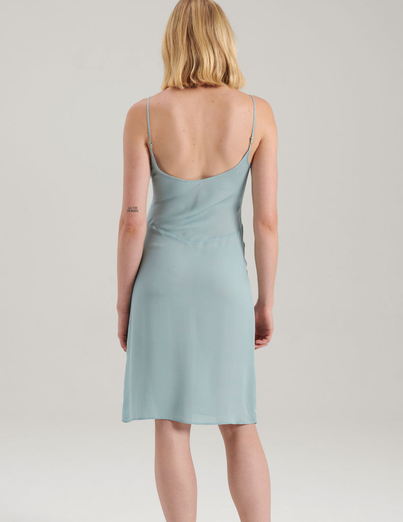 back view of light blue silk slip dress