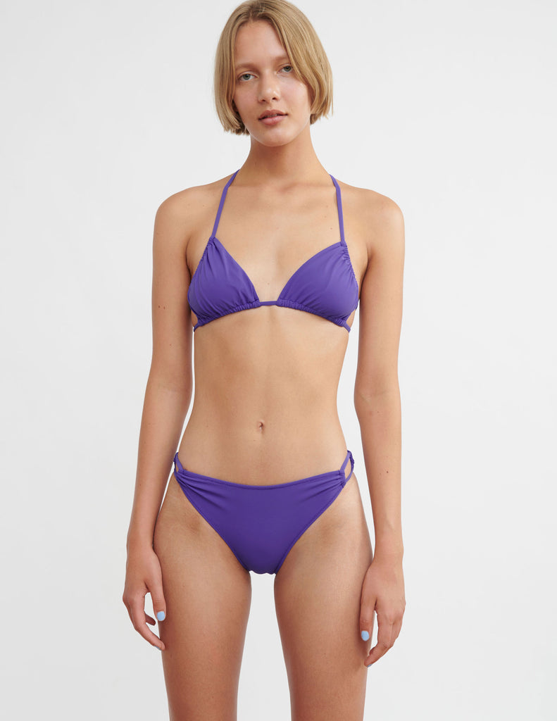 woman wearing purple string bikini by Araks
