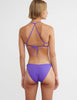 back of woman wearing purple string bikini by Araks