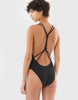 woman in black one piece with knotted back by Araks