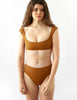 Woman in tan bikini set
