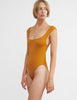 woman wearing brown one piece with cutout back by Araks