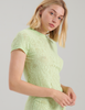 Woman wearing green lace t-shirt by Araks