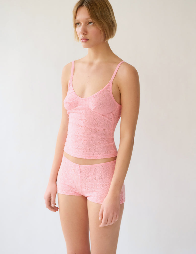 woman in pink lace cami and short