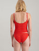 Backview of a woman wearing a bright red lace cami and panty.