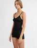 woman wearing black lace cami top and matching shorts by Araks