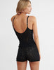 woman wearing black lace cami top and matching shorts by Araks