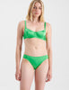 Woman in green silk bra and panty
