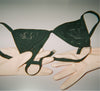 gloves and a black lace bra