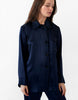 On model image 3/4 of blue button up long-sleeve top and bottoms