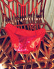 Red and magenta panty on chair.