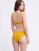 Woman wearing yellow underwire bikini and matching bottoms by Araks