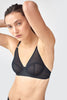 Front view of woman wears black mesh underwire bra