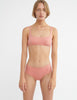 Front view image of model wearing pink bikini