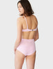 Face away, woman wearing a light pink wide scoop neck bikini top with matching high-waisted swim bottoms