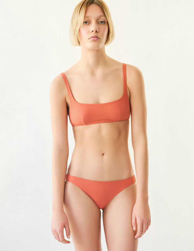 orange bikini top and bottom on model