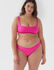 Front view of woman wearing pink bikini top with matching swim bottoms