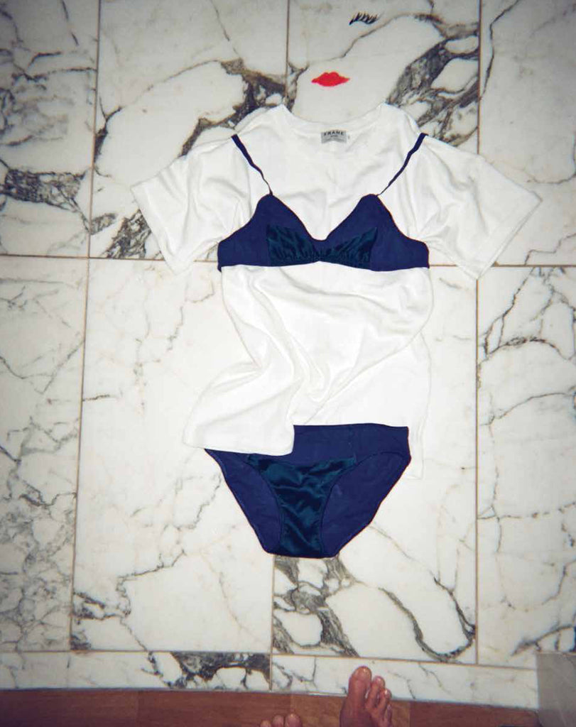 On the floor displays, a shirt with dark blue bralette with contrast panel and matching panty