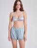 front view of blue boxer and bra on woman 