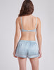 back view of blue boxer and bra on woman 