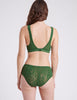 BACK SHOT OF WOMAN IN GREEN LACE BRA AND PANTY